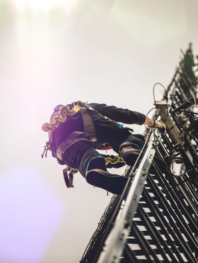 Telecom Worker Climbing Antenna Tower